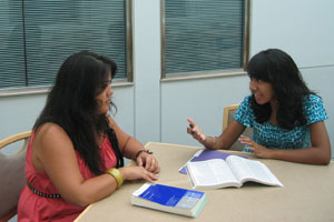 Alicia Mandac, CAS Academic Counselor and Peer Program Supervisor advising a student